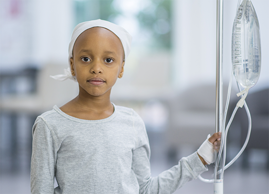 Young girl with I.V. stand.