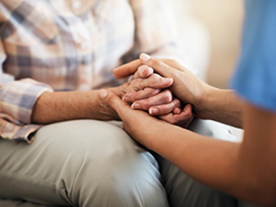 Patient being comforted by a nurse.