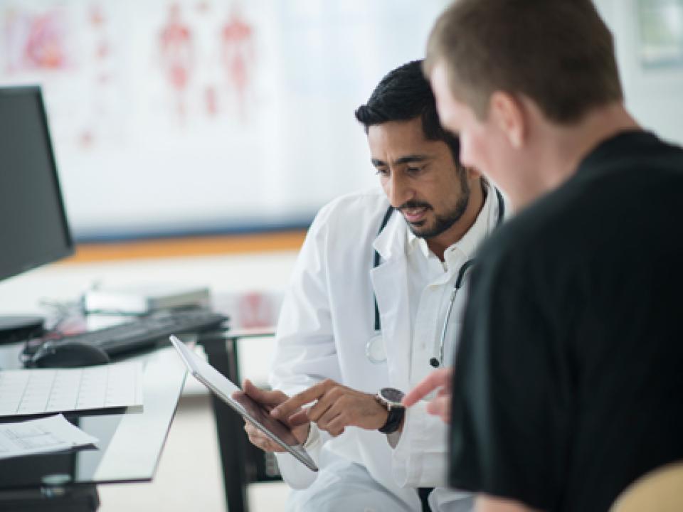 A patient speaks with a doctor