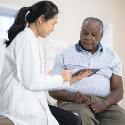 Asian doctor with African American patient