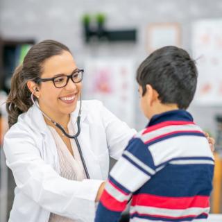 female doctor with child patient