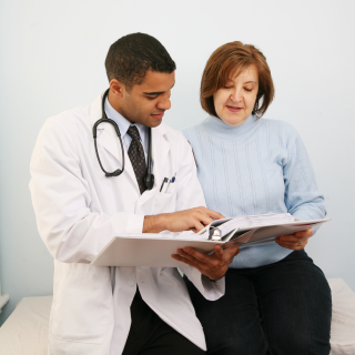 Male doctor with female patient