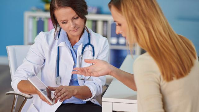 Female doctor with female patient. 