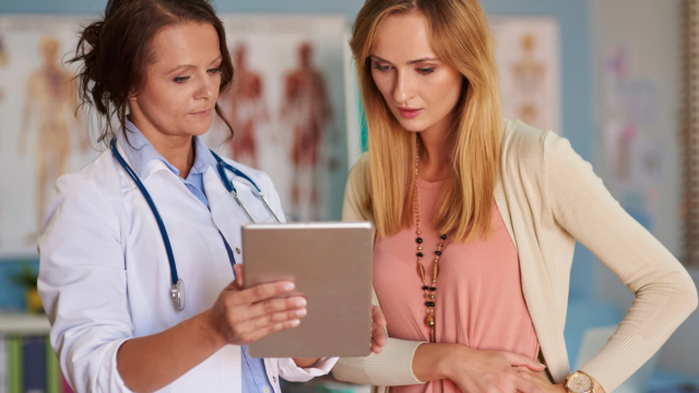 Female doctor with female patient