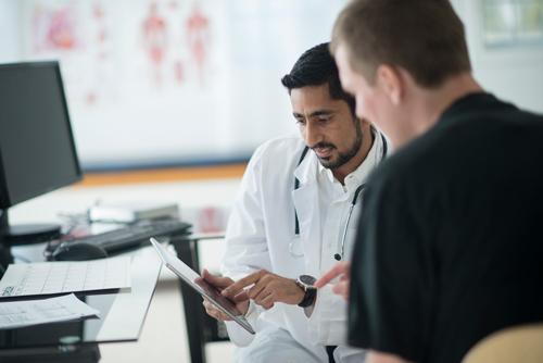 A patient speaks with doctor