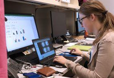 Scientist in lab working at computer