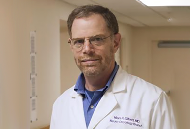 Headshot of Dr. Gilbert in lab coat