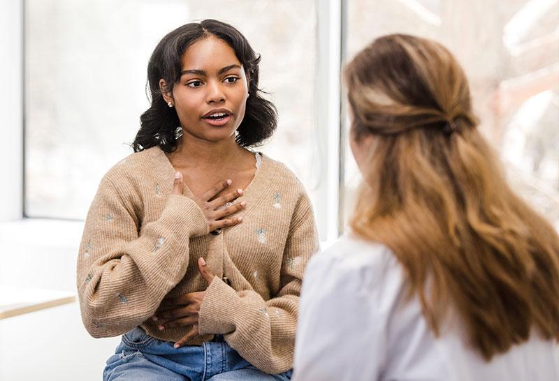 Teenage girl speaking to a doctor