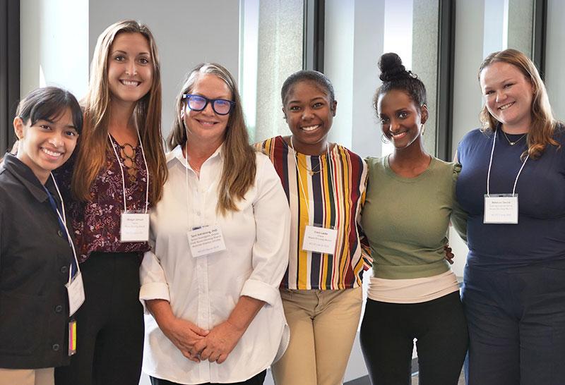 Terri Armstrong and five of her postbaccalaureate fellows.