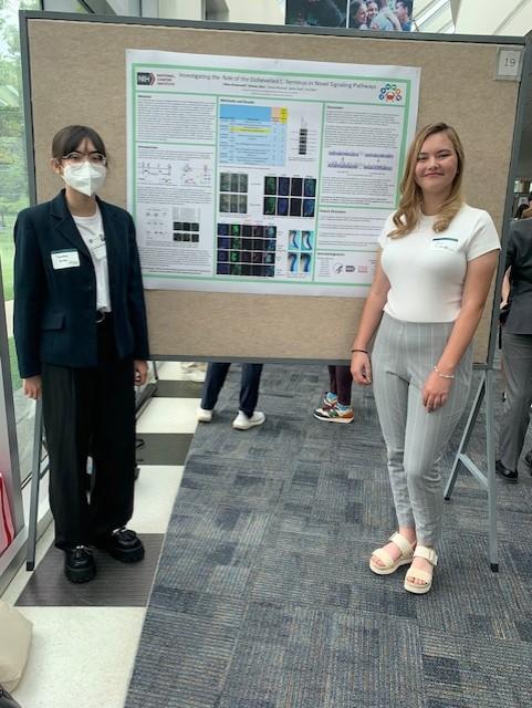 Valeska Zitta (SCRTA) and Olivia Bindewald (WHK HS Intern) present their research project at the NIH Summer Poster Event in Bethesda, MD on August 3rd, 2023