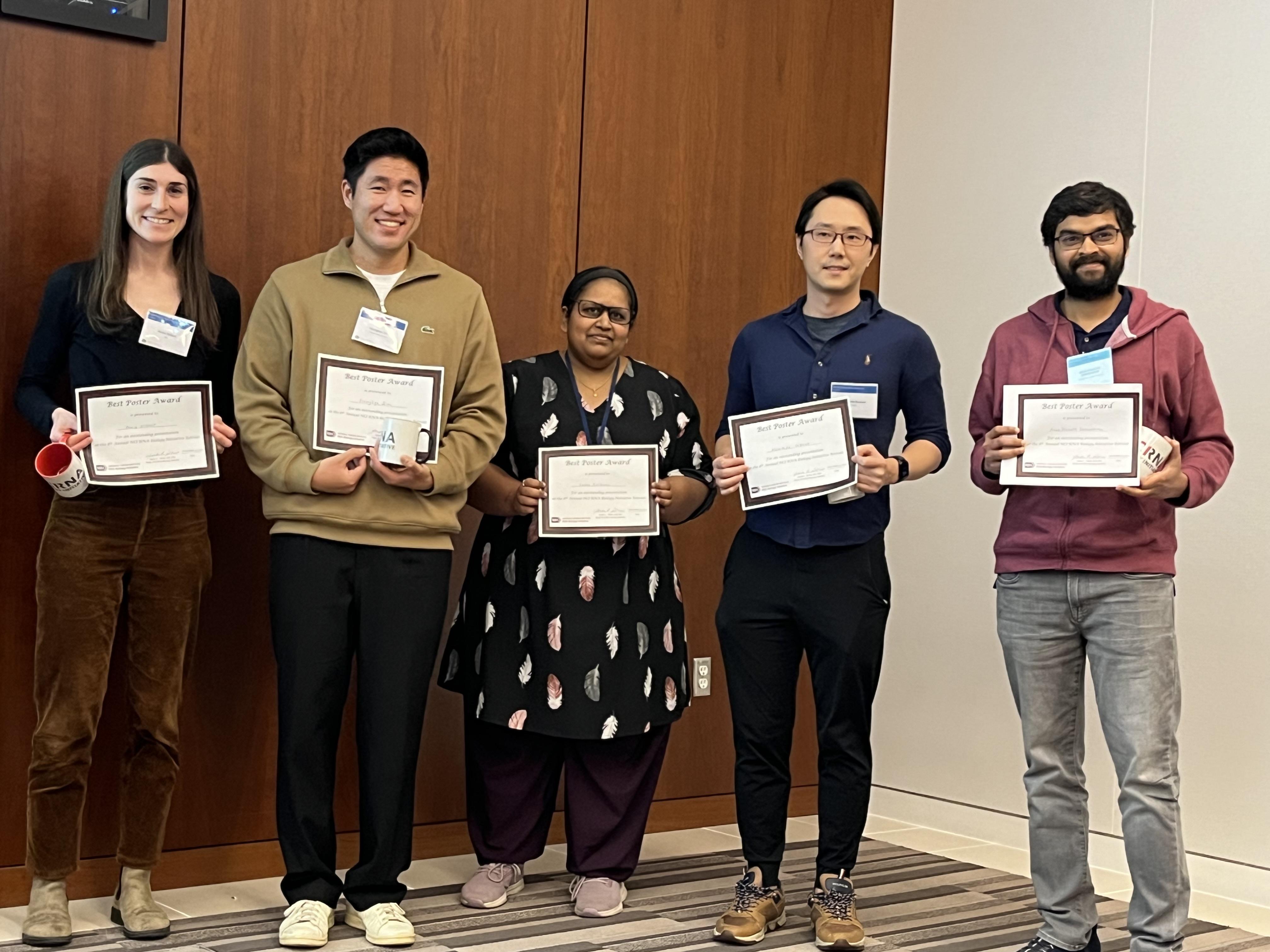 poster awardees holding their awards