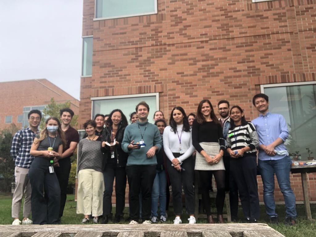 Dr. Taylor and her lab members pose for a photo outside of a research building